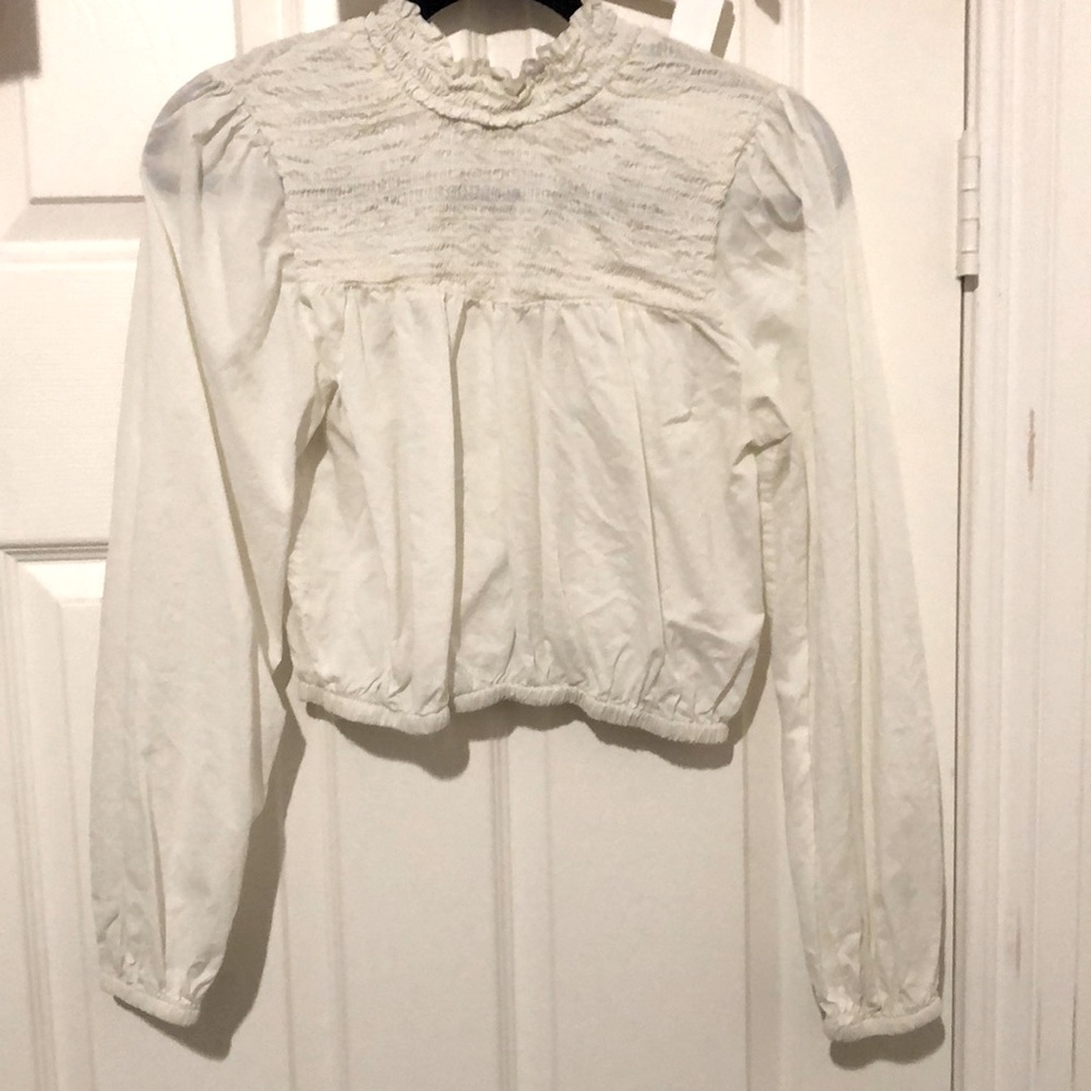 White ruffle blouse